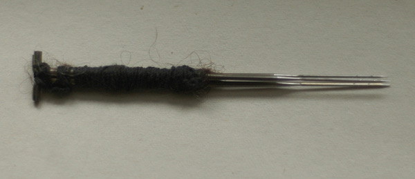 needle  
holder with three needles